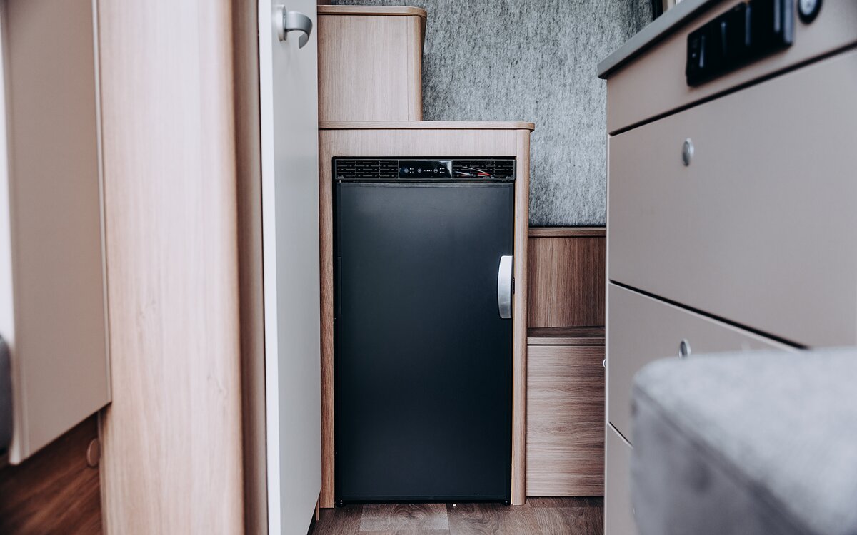 Fridge in the Carado motorhome between the kitchenette and the step