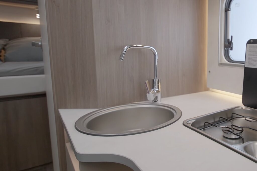 Carado motorhome kitchen with oval sink, tap and two-burner gas hob